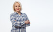 © missty - Attractive middle aged woman  in a plaid shirt with folded arms isolated on white background
