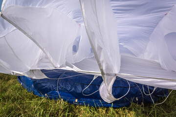 Abлhazia Sukhum Babushara 09.16.2017  Canopy of white parachute. A background with an abstract view of a colorful parachute. Parachute jumps. Active life style.