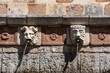 Famous mediaeval Fountain of 99 Spouts in ithe old town of L'Aquila, Italy