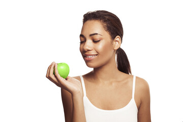 Wall Mural - Cute young woman with beautiful smile holding green apple. Healthy lifestyle, nutrition, dieting, weight loss,  dental care and healthy teeth conсept.