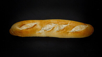 Fresh bread baguette loaf with seeds in a rustic style. Baking homemade healthy bread