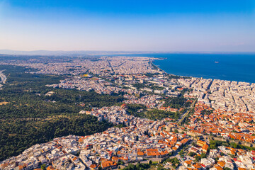 Beautiful weather and clear blue sky. Famous Greek port-city seen from aerial drone perspective. High quality photo