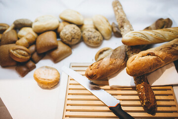 Wall Mural - Different types of bread on the table in the kitchen