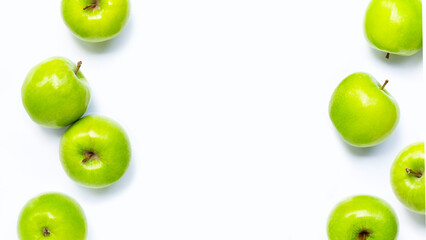 Wall Mural - Frame made of green apples on white background. Copy space