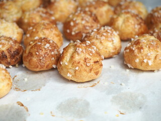 Canvas Print - fluffy golden brown baked French Chouquettes