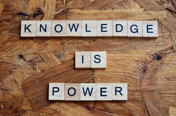 knowledge is power text on wooden square, motivation quotes