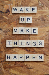 wake up make things happen text on wooden square, business quotes