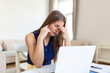 © Graphicroyalty - Young frustrated woman working at office desk in front of laptop suffering from chronic daily headaches,