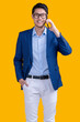 © whyframeshot - smiling asian businessman wear suit and glasses conversation business dealing agreement contract on smartphone isolate on yellow background studio shot