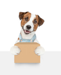 Poster - Jack russell terrier puppy holds big box above empty white banner. isolated on white background