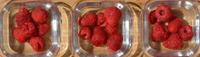 Fresh And Sweet Raspberries In Bowls On A Wooden Plate