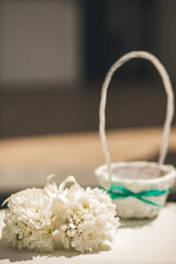 Wall Mural - White flowers on the wedding table near the basket