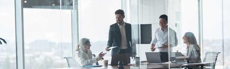 Wall Mural - Group of modern,Lawyers, Businesspeople and Investors Gather at the Table in Corporate Meeting Room.