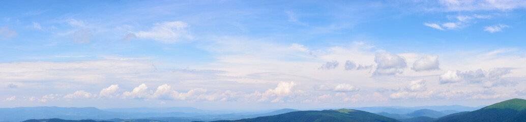 Wall Mural - panorama of a blue sky with fluffy cumulus clouds. bright sunny weather forecast in summer. beautifu