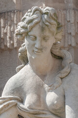 Wall Mural - Old sculpture of a sensual woman nymph bathing at the fountain in Zwinger gardens at historical and museums downtown of Dresden, Germany.