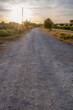 Dirt road on country side during sunset