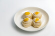 Chinese pastry puff, Beans cake with salted egg yolk lay on white plate on a white background