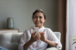 © fizkes - Happy beautiful millennial Indian woman using smartphone, looking at camera, smiling. Head shot portrait. Young cellphone user chatting, shopping on Internet, using online app