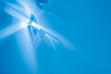 Wall Mural - Glass prisms and cubes with color spectrum rays. Abstract background with reflection and refraction of light. Shadow and rays of natural light effects..