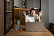 © Srdjan - Young stressed student or freelancer business woman having anxiety attack and migraine from bad internet connection while she working online on her laptop computer in home office.