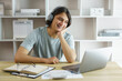 © Pichsakul - Distance education concept, Teen boy wearing headphone to listen lecture class online at home