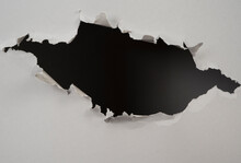 Ripped Hole In  Paper Background
