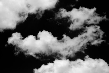 Wall Mural - clouds over black background .