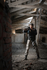 Wall Mural - Soldier in the abandoned building. Post apocalypse soldier concept.