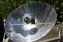 Heating A Teapot By Sunlight Using A Parabolic Mirror In Nepal