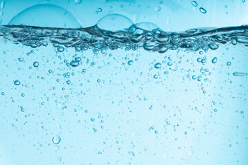 Poster - blue splash of water in a glass vessel