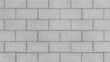 © Hanna - Grey brick wall background close up. Gray stone tile block background with horizontal texture of gray brick. Gray brick surface.