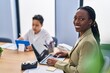 © Krakenimages.com - African american mother and son using laptop and touchpad working at office