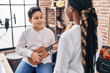 Poster - African american mother and son student learning play ukelele at music studio