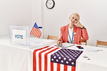 Poster - Beautiful caucasian woman working at political campaign smiling doing phone gesture with hand and fingers like talking on the telephone. communicating concepts.