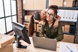 © Krakenimages.com - Woman and girl ecommerce call center agent working with her daughter at office