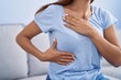 © Krakenimages.com - Young woman examining breast with hands at home