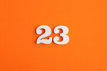 White Wooden Number 23 On Eva Rubber Orange Background