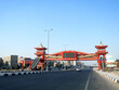 Shinzo Abe axis patrol highway in Egypt with a pedestrian bridge finished in traditional Japanese architectural style, the traffic highway is named on former Japanese PM