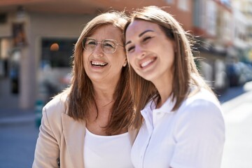 Poster - Mother and daughter smiling confident standing together at street