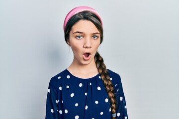 Sticker - Young brunette girl wearing elegant look afraid and shocked with surprise expression, fear and excited face.