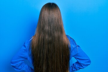 Sticker - Young brunette girl wearing turtleneck sweater standing backwards looking away with arms on body