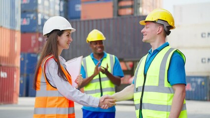 Wall Mural - Group of attractive male and female worker work in container terminal.