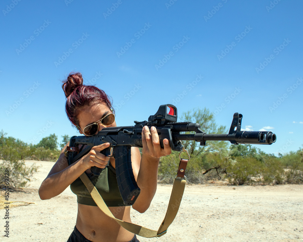 Tactical Rifle Crop Cute girl wearing crop top holding a custom Russian AK-47 assault rifle ...