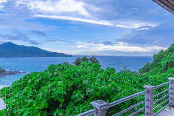 Colourful Skies Sunset over Head Laem Sing Beach in Phuket Thailand. This Lovely island waters are turquoise blue waters, lush green mountains colourful skies and beautiful views of Pa Tong Patong