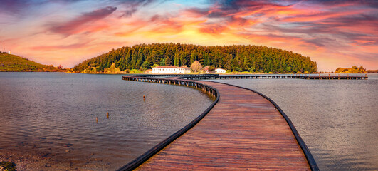 Wall Mural - old wooden pathbridge to st mary's monastery. wobderful sunrise on narta lagoon. astonishing outdoor