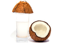 Coconut In Two Half And Small Pieces Of Coconut Coconut Oil And Coconut Water In A Glass Selective Focus