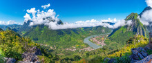 View From The Top Viewpoint Of Nong Khiaw - A Secret Village In Laos. Stunning Scenery Of Limestone Cliff Valley Covered With Green Rainforest Jungle Mysterious Clouds.