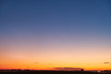Gradient Of Orange-blue Evening Sky Without Clouds At Sunset