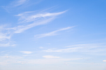 Blue sky with thin cirrus clouds, daytime landscape