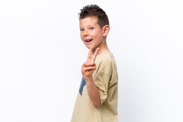 Wall Mural - Little caucasian boy isolated on white background smiling and showing victory sign